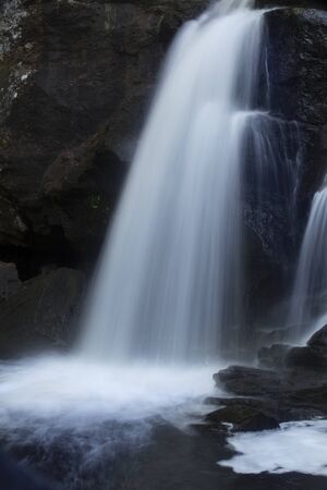 Chapman Falls in long exposure, cascading onto rocks at Devil's Hopyard State Park, Connecticut. Vertical image.の写真素材