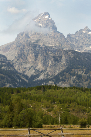 Jackson Hole, with Grand Teton Mountains and rail fence, Grand Teton National Park, Wyoming.の写真素材