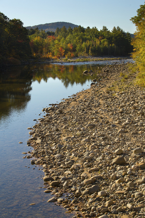Pemigewasset River in North Woodstock, New Hampshire, in the White Mountains National Forest, with tree reflections on still water.の写真素材