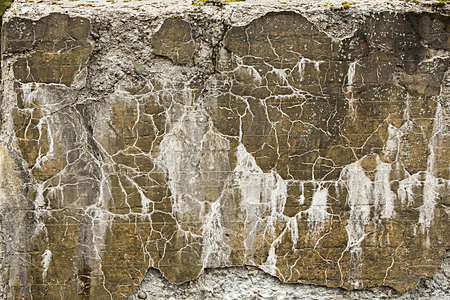 Erosion patterns on deteriorating old concrete abutment of a railroad bridge across the Rangeley River, which connects Rangeley Lake with Mooselookmeguntic Lake in northwestern Maine.の写真素材