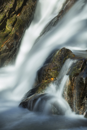 Blurred motion closeup of a waterfall on Whiting River at Campbell Falls State Park in Norfolk, Connecticut.の写真素材