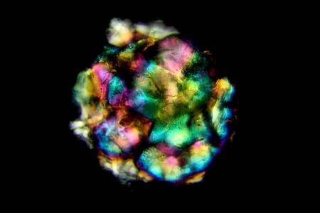 One grain of sand from a Connecticut beach on Long Island Sound. Light refraction gives this grain...