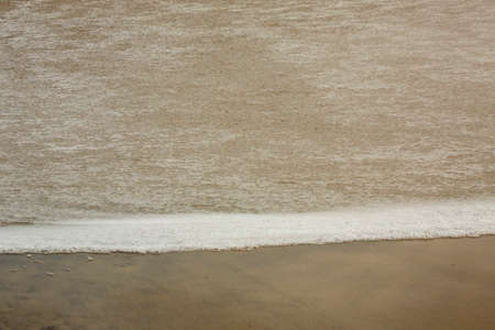 Waves roll in late winter on the beach at Assateague Island National Seashore in Maryland, USA.