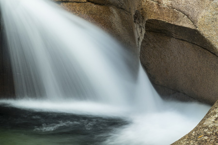 Close view of waterfall known as "The Basin," a granite pothole cascade of the Pemigewasset River in Franconia Notch State Park, Lincoln, New Hampshire.のeditorial素材
