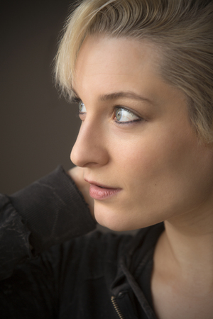 Head And Shoulders Portrait Of Beautiful Young Woman With Short