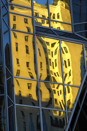 Abstract reflections in mirror-like glass of a building in PPG Place, at the end of a sunny fall day...