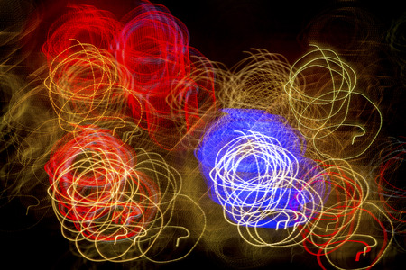 Abstract light trails, with major distortion and blurring of lights in downtown Pittsburgh, Pennsylvania, at night.の写真素材