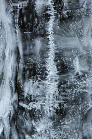 Bubbles and patterns inside clear icicles at Blackledge Falls Park in Glastonbury, Connecticut.の写真素材