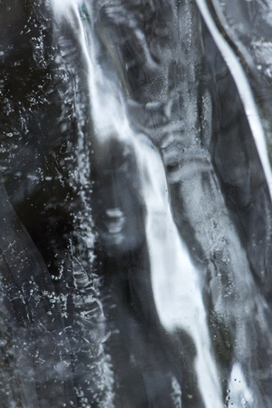 Bubbles and patterns inside clear icicles at Blackledge Falls Park in Glastonbury, Connecticut.の写真素材