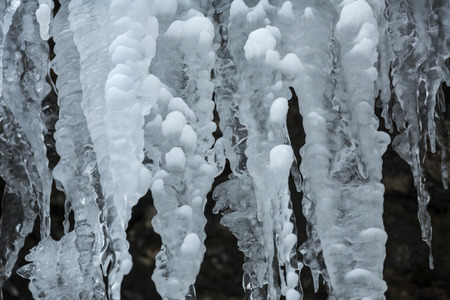 Bubbly tufts in winter ice formations on the rocks at Blackledge Falls Park in Glastonbury, Connecticut.の写真素材
