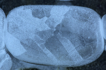 Abstract patterns and shapes in thin ice of the Hockanum River in Vernon, Connecticut, in winter.の写真素材
