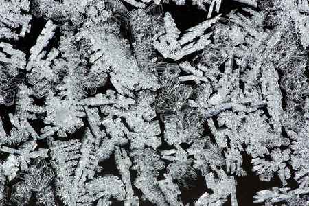 Feathery ice patterns on a frosted window in the winter in northern Maine.