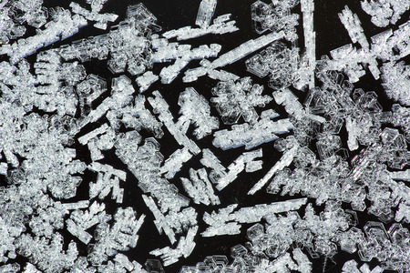 Feathery ice patterns on a frosted window in the winter in northern Maine.の写真素材