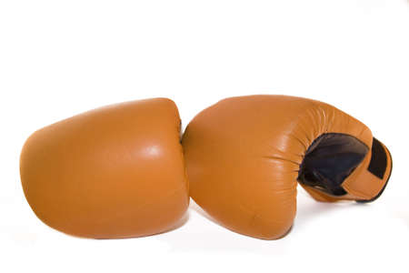 pair of bright orange boxing gloves with deep blue palmsの写真素材