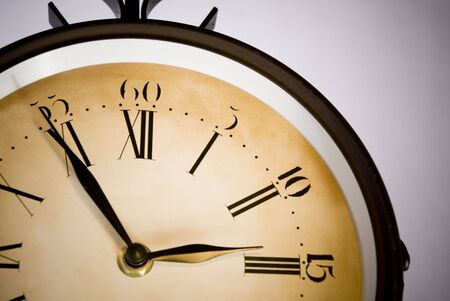 old clock marking three o'cloc in white backgroundの写真素材