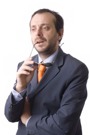 young business man holding sunglasses and thinkingの写真素材