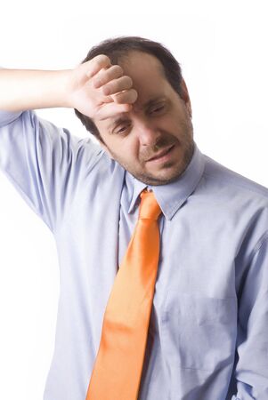 young businessman tired and with headache in white backgroundの写真素材
