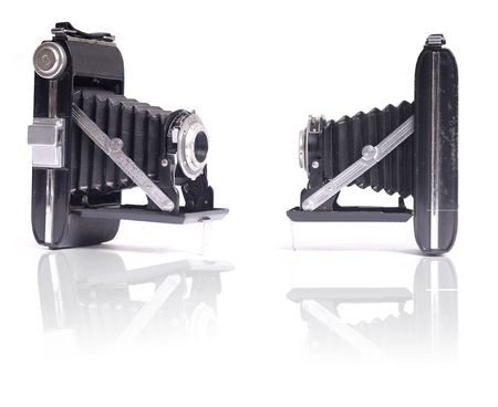 old camera in a white background in two positionsの写真素材