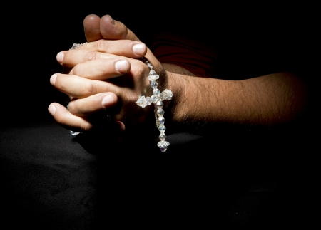 Praying Hands in black backgroundの写真素材