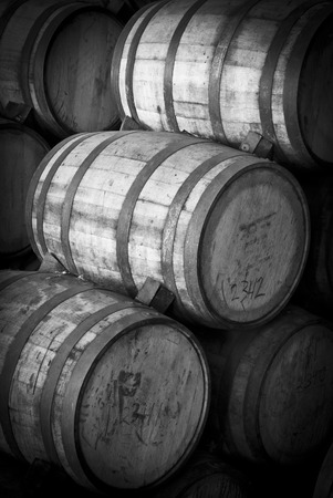 Wine barrels stacked in the old cellar of the winery の写真素材