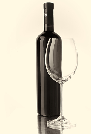 Bottle and wine glass in white back groundの写真素材