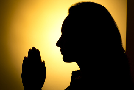 Praying Hands in black backgroundの写真素材