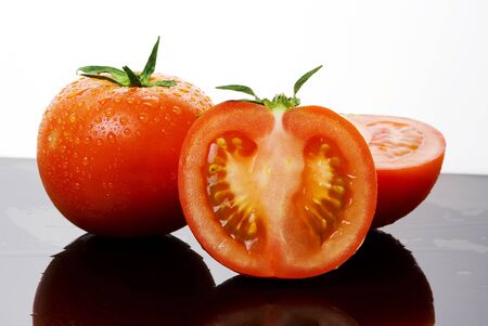 vegetable tomato red with cutの写真素材
