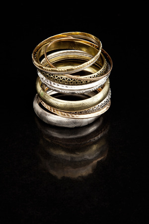 Gold and silver braceletsの写真素材