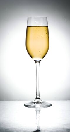 glass of licour in a mirrorの写真素材
