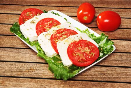 Salad with cheese, lettuce and tomatoの写真素材
