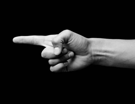 Hand signal in a black backgrownd