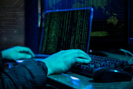 Hacker using laptop with binary code digital interface. Double exposure. Hacking and malware...
