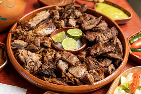 Delicious Grilled roast beef and sheep with sheep with tortillas sauce and salads. Mexican food.