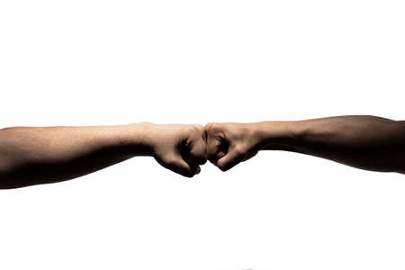 Friends hit their hands very strong in white backround. dramatic lightsの写真素材