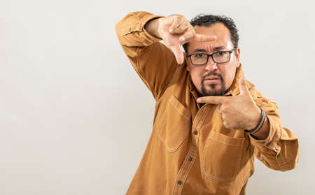 expression and people concept - angry man with funny face over gray background. Adult over 40 years of age.の写真素材