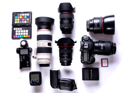 professional photographic equipment with digital camera, lenses and accessories.