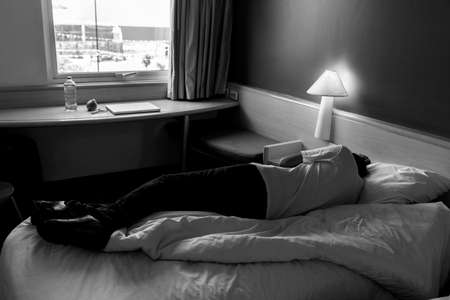 Sleeping man in the room of his house or hotel. During the COVID-19 pandemic.