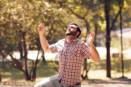 Spiritual man doing day prayer in the forest.の写真素材