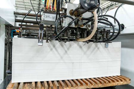 Close up of an offset printing machine during production