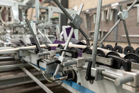 Close up of an offset printing machine during production