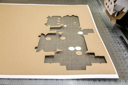 Close up of an offset printing machine during production. making boxesの写真素材