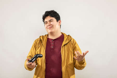 Expression session. Young man playing videogames with different facial expressions