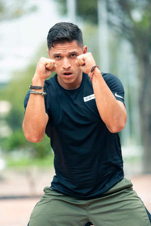 Young man exercising outdoors. Sports lifestyle.