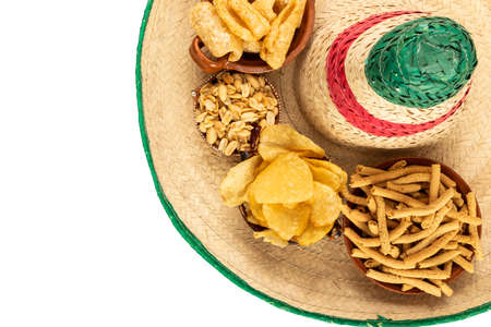 Variety of delicious mexican snack on a mexican hat in white background. Overhead shotの写真素材