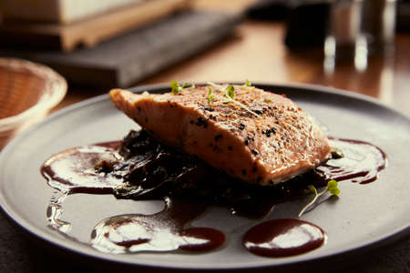 Delicious and elegant gourmet saucers on wooden table. Delicious food