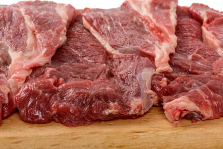 detail of a cutting board with beef tittle steak. gourmet food