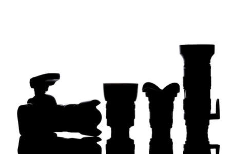 Professional photographic equipment with digital camera, lenses and accessories. black and white...