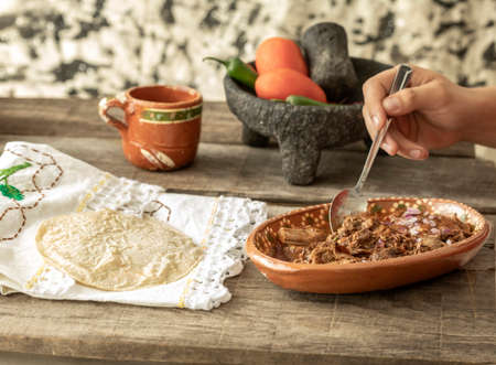Detail of a typical mexican breakfast. delicious plate of birriaの写真素材
