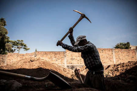 Detail of real tired man working in the construction. Man activeの写真素材