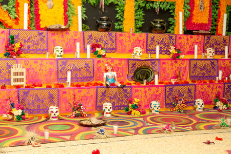Traditional Mexican Day of the dead altar with sugar skulls and candlesの写真素材